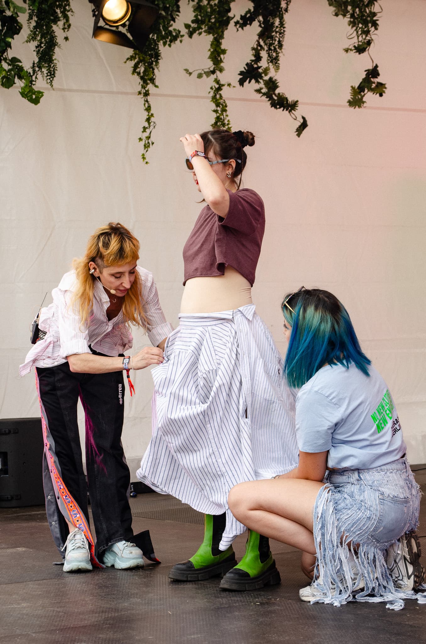 Team members preparing an upcycled look