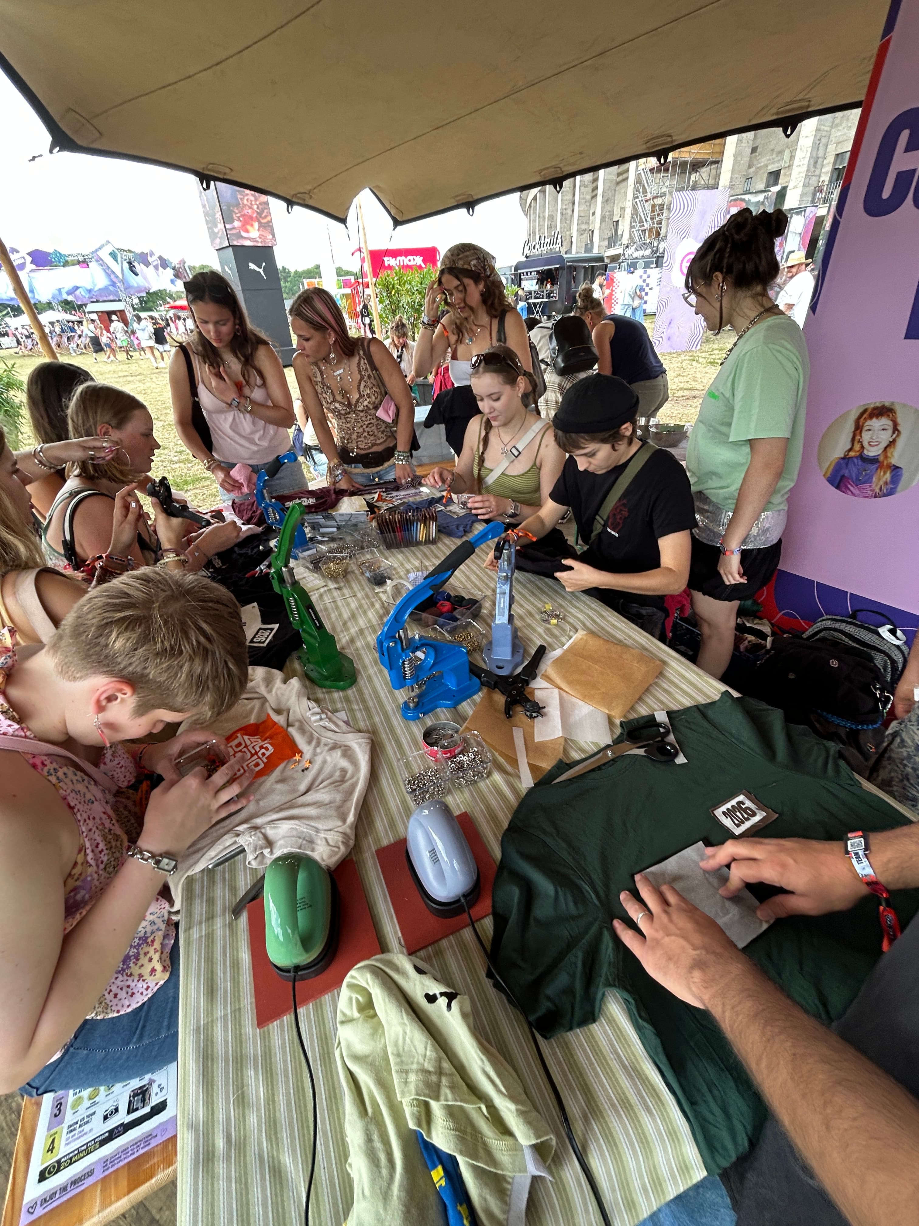 Visitors customizing clothing at the upcycling station